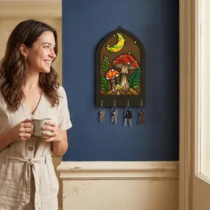Wooden mushroom key holder wall decor lifestyle detail view, bohemian style organizer.