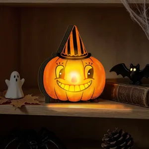Close-up view of vintage wooden pumpkin lighted ornament showcasing holiday details.