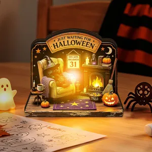 Detailed view of Halloween light-up wooden desktop decoration with black cat and fireplace.