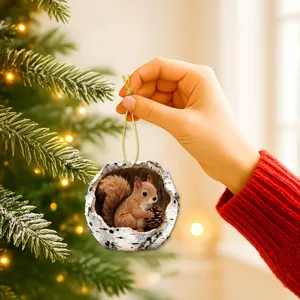 Close-up detail of a cute squirrel in tree hole Christmas tree hanging ornament holiday decor.