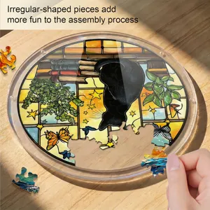 Acrylic cat puzzle detail shot, stained glass style window hanging with irregular pieces.