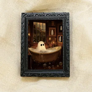 Close-up detail of the Halloween ghost in bathtub fridge magnet with ornate black frame.