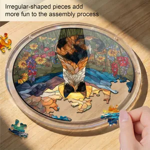 Detailed view of a round acrylic cat suncatcher puzzle with stained glass style pieces.