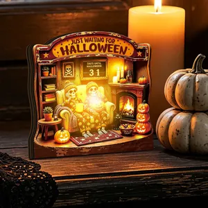 Detailed view of the glowing wooden Halloween ornament featuring a spooky skeleton couple.