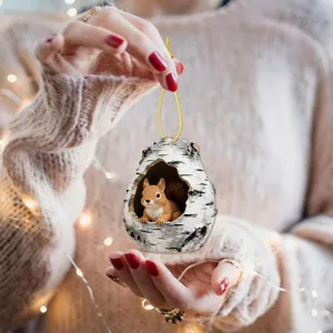 Cute squirrel in birch hollow hanging ornament detail, perfect for cozy holiday home decor.