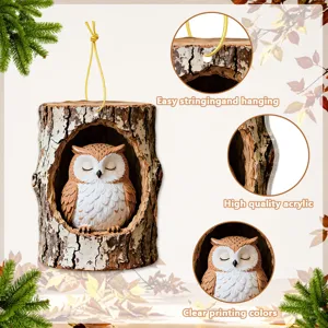 Detailed view of the acrylic owl tree stump hanging ornament with clear printing and gold string.