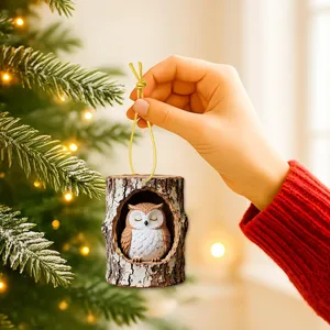 Detailed view of cute sleeping owl inside a rustic tree trunk hanging ornament, cozy Christmas decor.