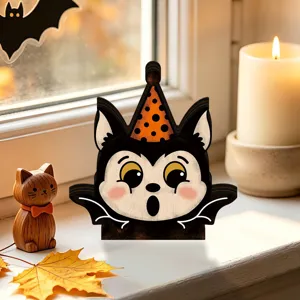 Close-up detail of the retro wooden Halloween cat bat table decor on a cozy windowsill.