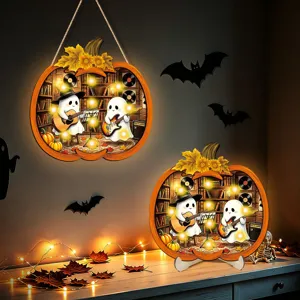 Detailed view of Halloween glowing wooden pumpkin sign with cute ghost band and warm LED lights.