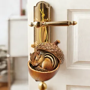 Adorable chipmunk sleeping in acorn shell hanging ornament for home and door decor.