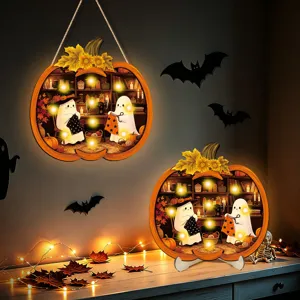 Halloween glowing wooden pumpkin hanging sign detail view with cute ghost craft scene and LED lights.