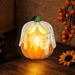 Halloween wooden glowing pumpkin ornament close-up, retro festival home decor detail