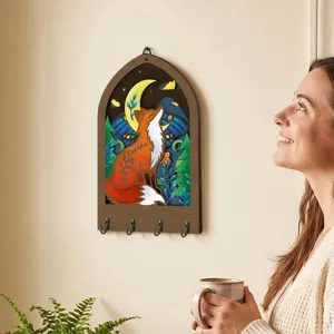 Bohemian wooden key holder wall decor with carved fox and forest design for home entryway.