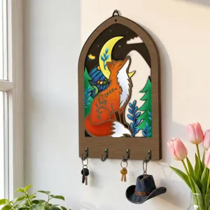 Wooden wall key holder with fox design and hooks for home hallway and room decor detail