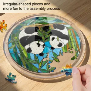 Detailed view of the acrylic panda stained glass puzzle showing colorful pieces on a wooden table.