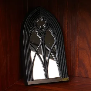 Gothic arched window mirror for vintage home decor, black decorative wall accent piece.
