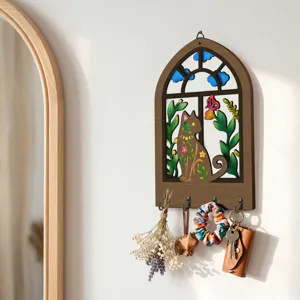 Close-up of the Bohemian wooden key holder wall decor featuring a cute cat window design.