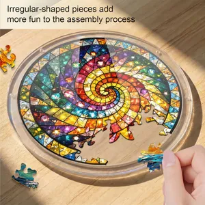 Close-up detail shot of a colorful spiral stained glass acrylic puzzle piece being placed.