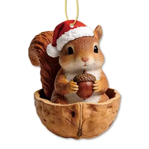 Detailed view of cute Christmas squirrel pendant sitting in a walnut shell ornament.