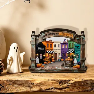 Halloween lighted wooden street scene desktop decoration with miniature spooky houses and glow.