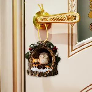 Resin tree hole owl pendant hanging decor with mini lantern for winter holiday decoration.