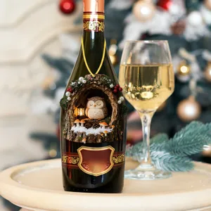Close-up detail of a charming Christmas tree hole owl bottle decoration with warm light.