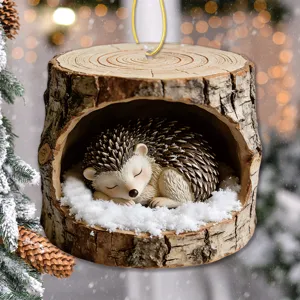 Christmas tree hanging ornament featuring cute sleeping hedgehog in snowy tree stump decor.
