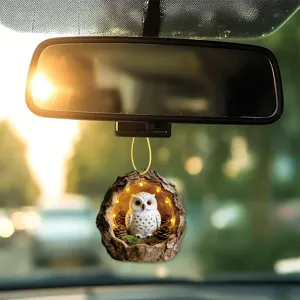 Car rearview mirror hanging ornament featuring a cute owl in tree hole design with glowing lights.