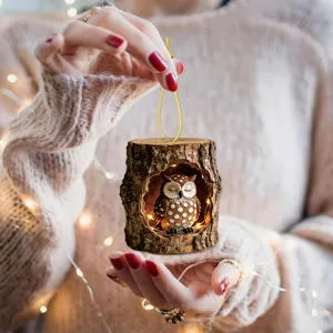 Mini resin tree hollow owl hanging ornament with warm LED lights for cozy home decor.