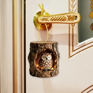 Resin owl tree hole hanging pendant with warm lights for home room and door decoration.