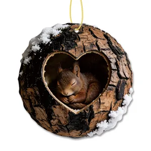 Christmas tree hanging ornament featuring cute sleeping squirrel in heart tree hole design.