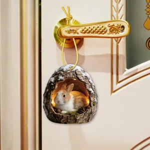 Detailed close-up view of acrylic bunny tree hole hanging ornament, perfect for door decor.