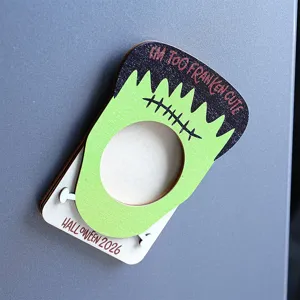 Close-up detail of Halloween wooden Frankenstein magnetic photo frame with cute festive design.
