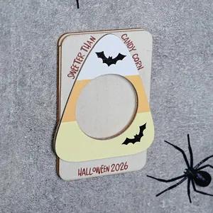 Close-up detail of Halloween wooden candy corn photo frame with magnetic holiday decor.