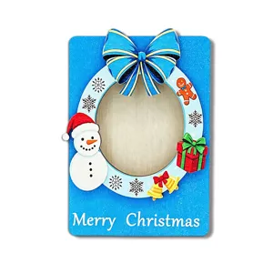 Wooden Christmas photo frame fridge magnet with cute snowman and festive holiday decorations.