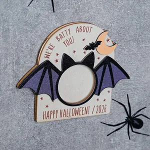 Halloween wooden magnetic photo frame detail, bat wings design, holiday decorative charm.