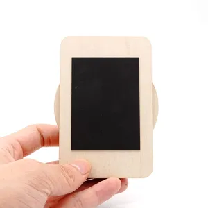 Close-up detail of the wooden magnetic photo frame, featuring a smooth texture and black surface.