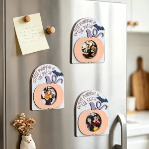 Detail shot of Halloween pumpkin magnetic photo frame showcasing wooden holiday decor on fridge.