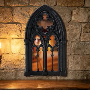 Gothic arch window wall mirror detail, vintage black decorative frame, rustic stone background.