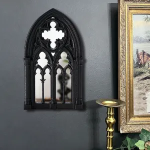 Gothic arch window mirror wall decor detail, vintage black decorative frame style closeup.