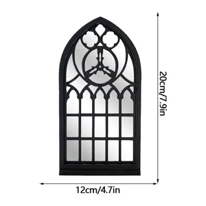 Close-up detail of Gothic arched window mirror with decorative black frame and dimensions.