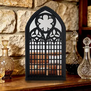 Detailed view of gothic window mirror, vintage arched wall decor display in a cozy room.
