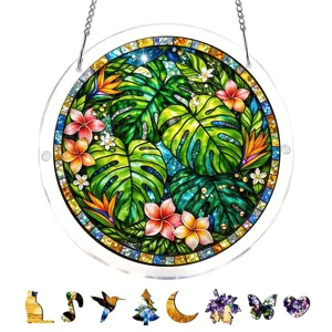 Detailed view of stained glass acrylic suncatcher with tropical plant design and whimsy puzzle pieces.