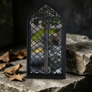 Gothic window mirror home decor detail view, vintage black arched cathedral mirror ornament.
