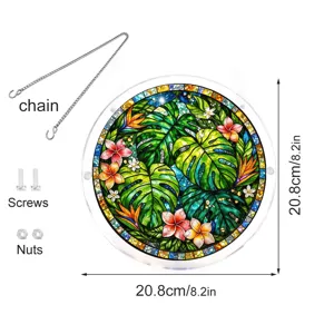 Acrylic stained glass suncatcher detail view showing tropical monstera leaves and accessories.