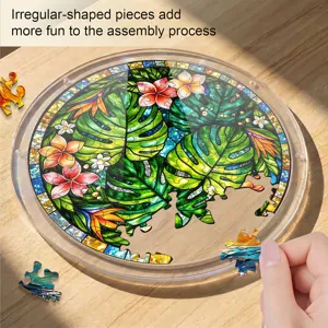 Acrylic suncatcher puzzle detail featuring tropical leaf and flower stained glass art design.