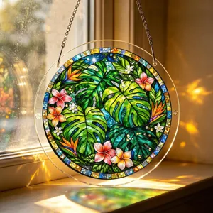 Stained glass style tropical monstera leaf suncatcher hanging window decor detail view.