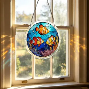 Attrape-soleil suspendu en puzzle acrylique avec poisson-clown pour fenêtres.