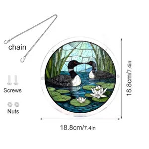 Acrylic suncatcher detail showing circular loon bird pattern, hanging chain, and hardware.
