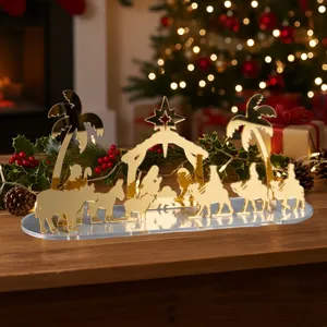 Creche de Noel en acrylique dore decoration de table vue de detail, ornement de fete chic.